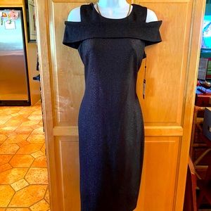 Cocktail black shimmering off shoulder dress.